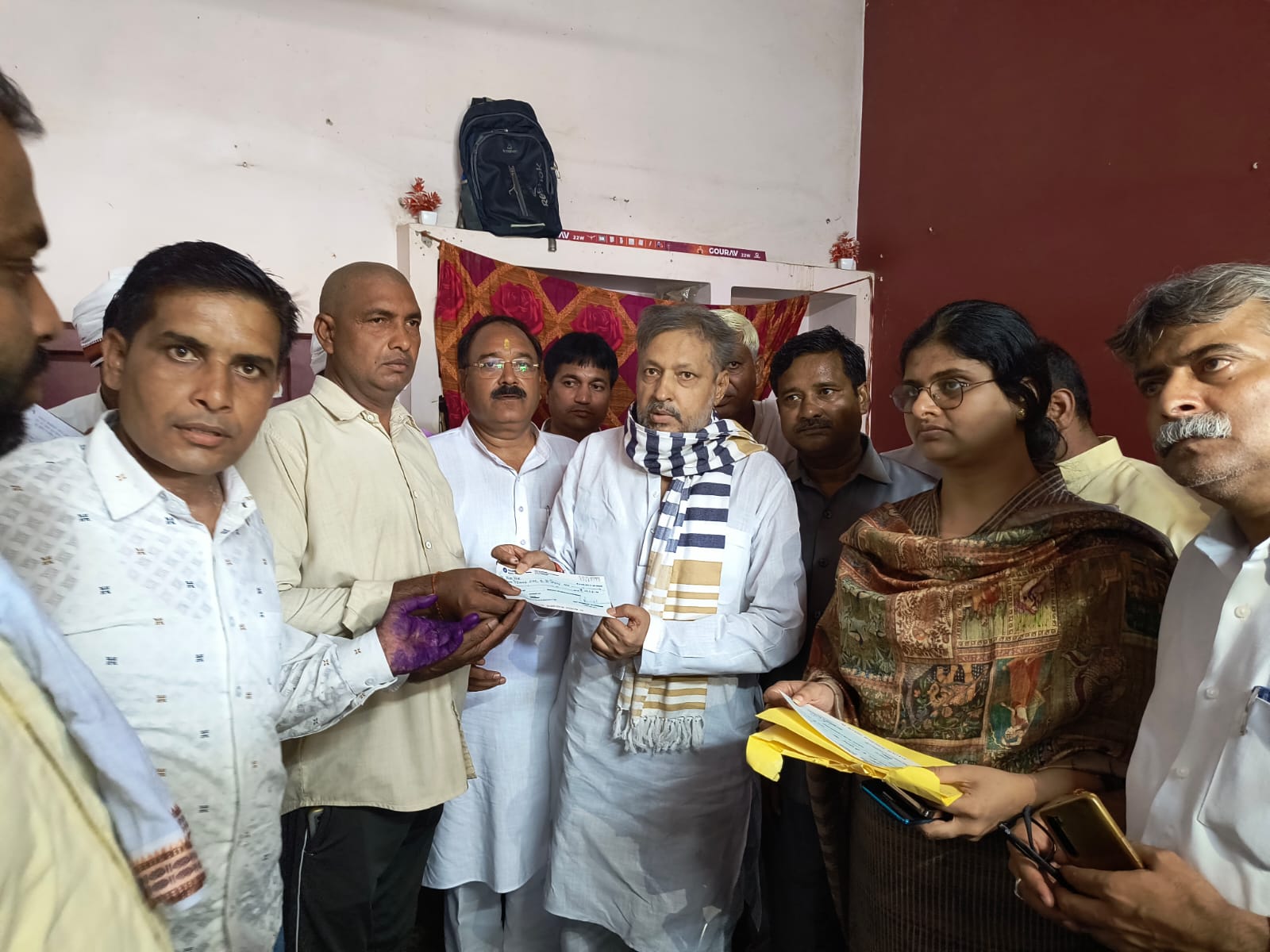 MLA handed over checks of financial assistance to his relatives